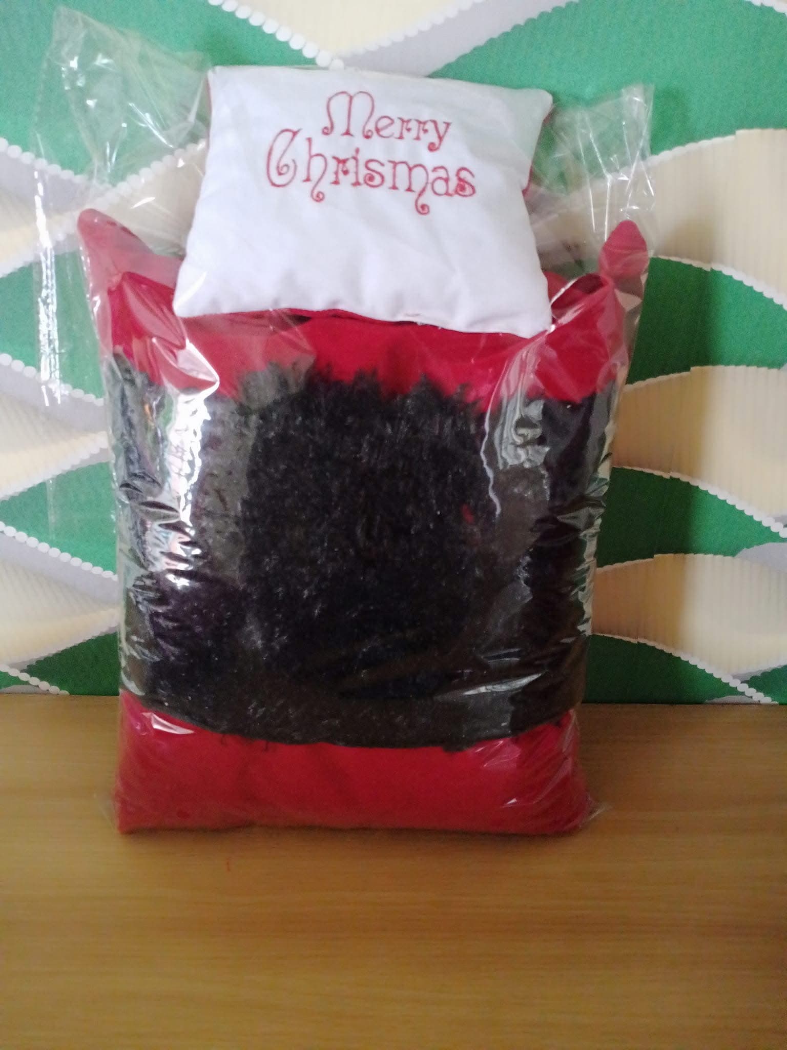 Black rug freshly packaged for delivery